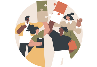 Four people working together to complete a puzzle